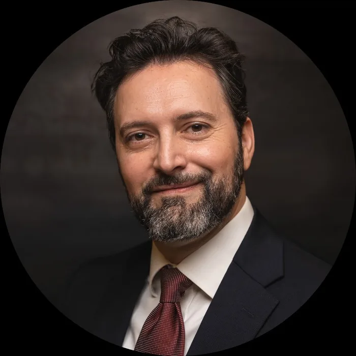 CLAUDIU A. BARBOS