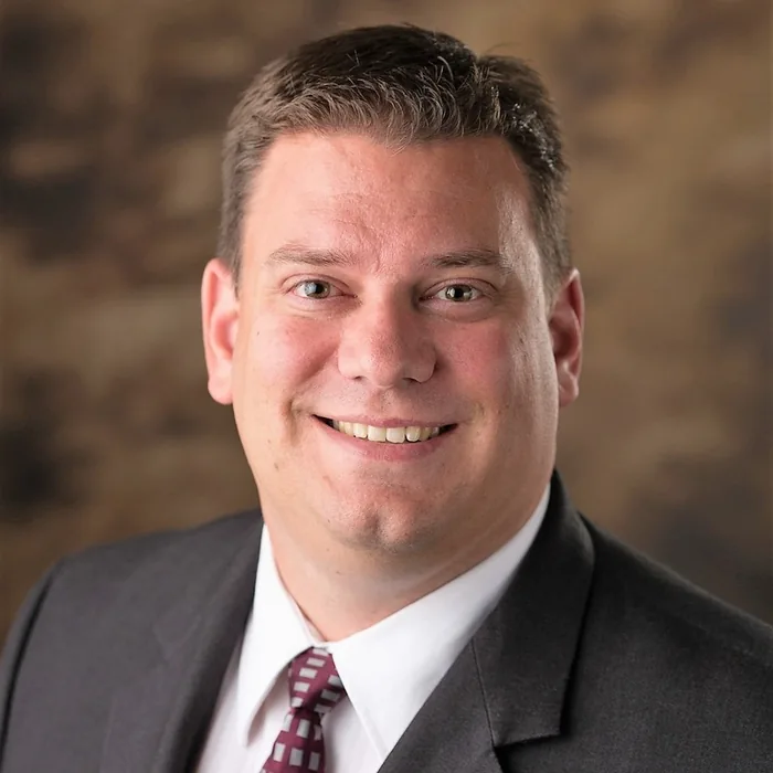BRIAN M. MUCH